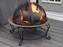 A real fire in this fire pit bowl, which includes a protective screen