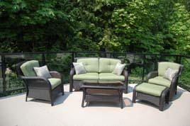 Deck furniture with green comfy cushions